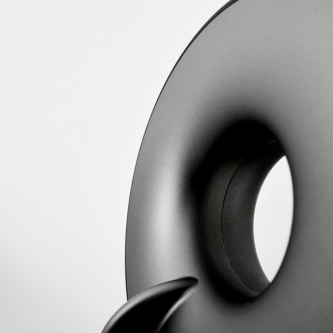 Macro — the perforated surface and matte CMF finish